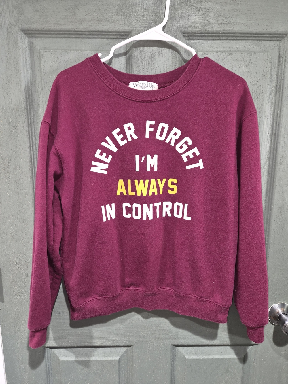 Wound Up Plum Crewneck Sweatshirt with White and Yellow Graphic